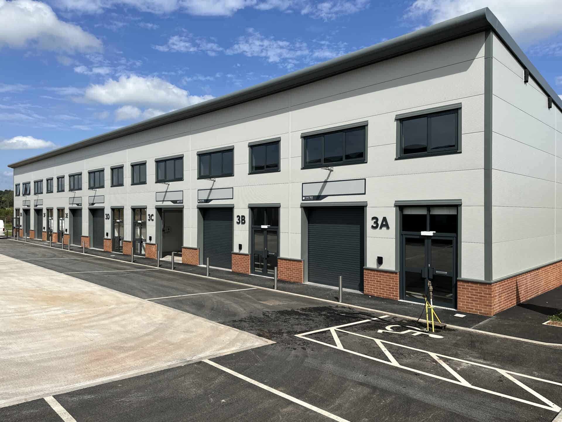 Exterior view of a row of units at Oak Tree, Kingskerswell, showcasing the flexible and multifunctional commercial spaces in this location.