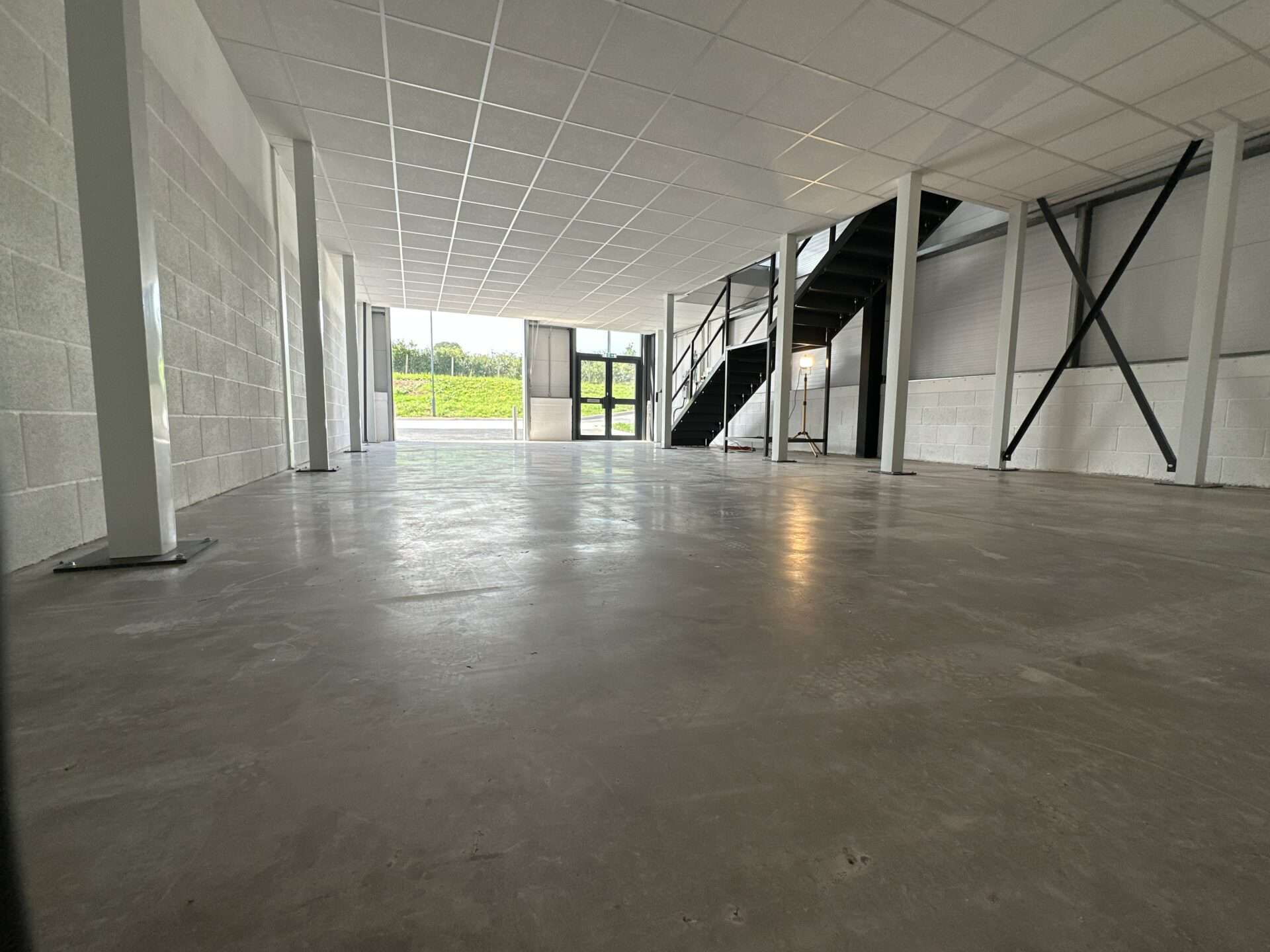 Interior view of a light industrial unit at Oak Tree, Kingskerswell, with a full mezzanine layout, offering flexibility for client-specific adaptations.