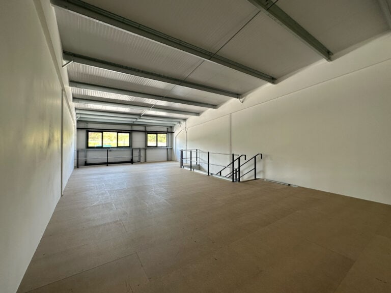 Interior view of a light industrial unit at Oak Tree, Kingskerswell, with a full mezzanine layout, offering flexibility for client-specific adaptations.