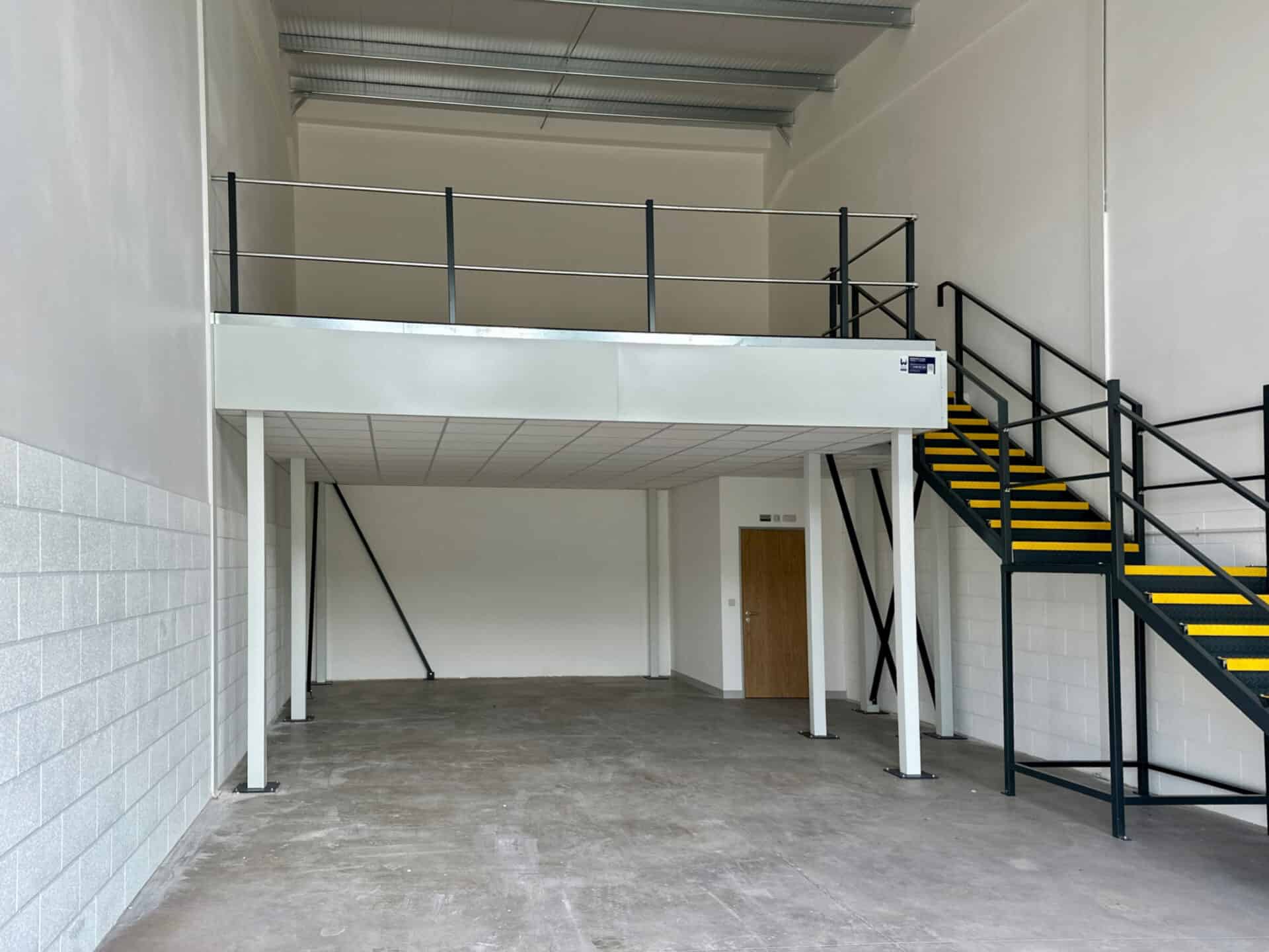 Interior view of a light industrial unit at Oak Tree, Kingskerswell, with a half mezzanine layout, offering flexibility for client-specific adaptations.