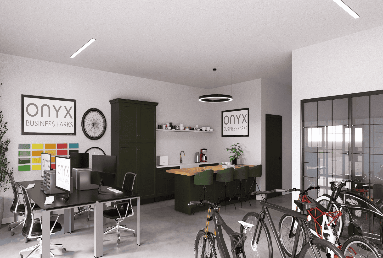 A modern office space with a focus on bike sales, featuring sleek workstations, a kitchenette area with green cabinets and a wooden countertop, and a display of bicycles. The space includes Onyx Business Parks branding and ample natural light through large windows.