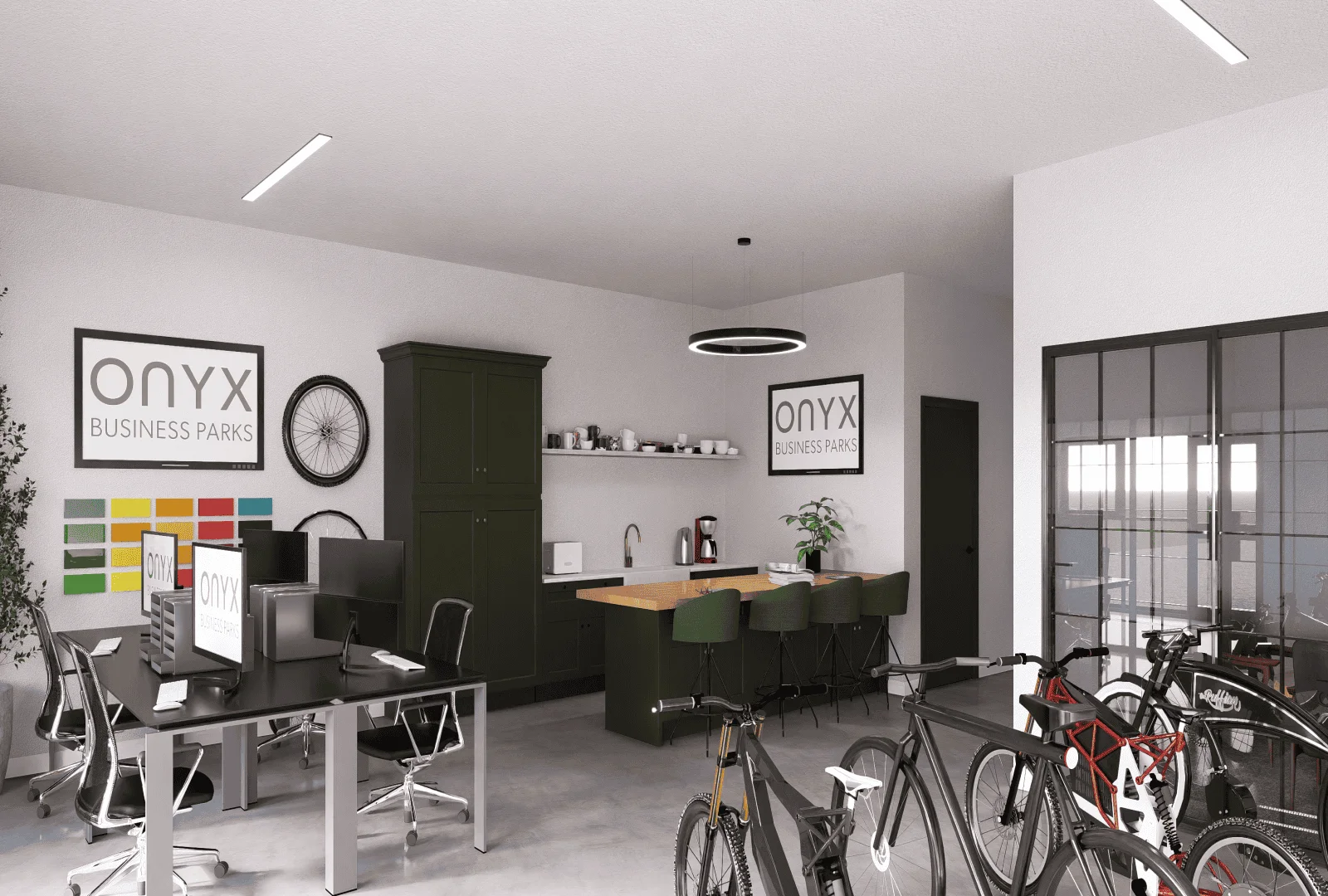 A modern office space with a focus on bike sales, featuring sleek workstations, a kitchenette area with green cabinets and a wooden countertop, and a display of bicycles. The space includes Onyx Business Parks branding and ample natural light through large windows.