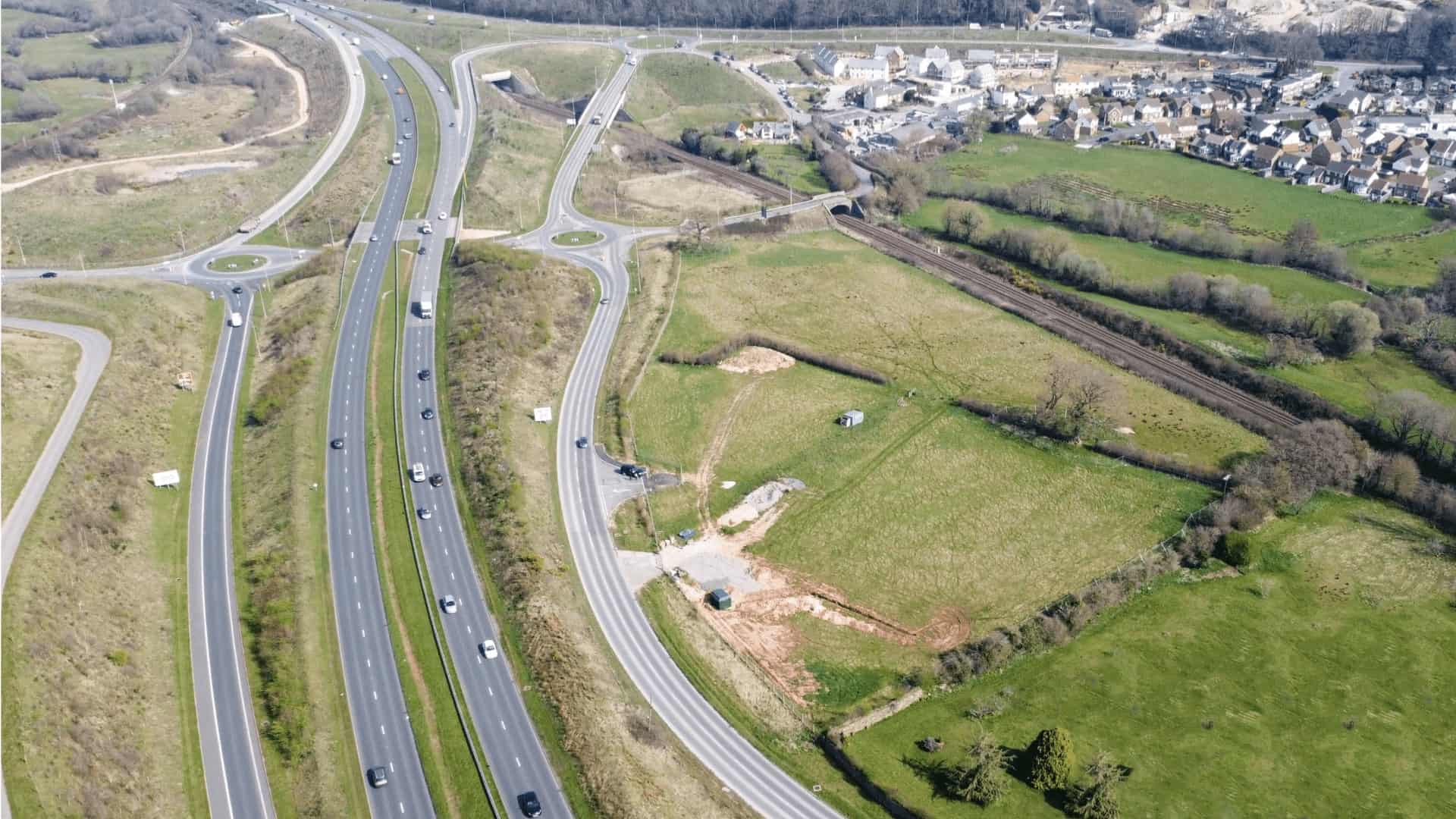 Aerial view of the Oak Tree site in Kingskerswell, showcasing the scenic surroundings. This image provides a perspective of the location for potential development of flexible and sustainable workspaces by Onyx.