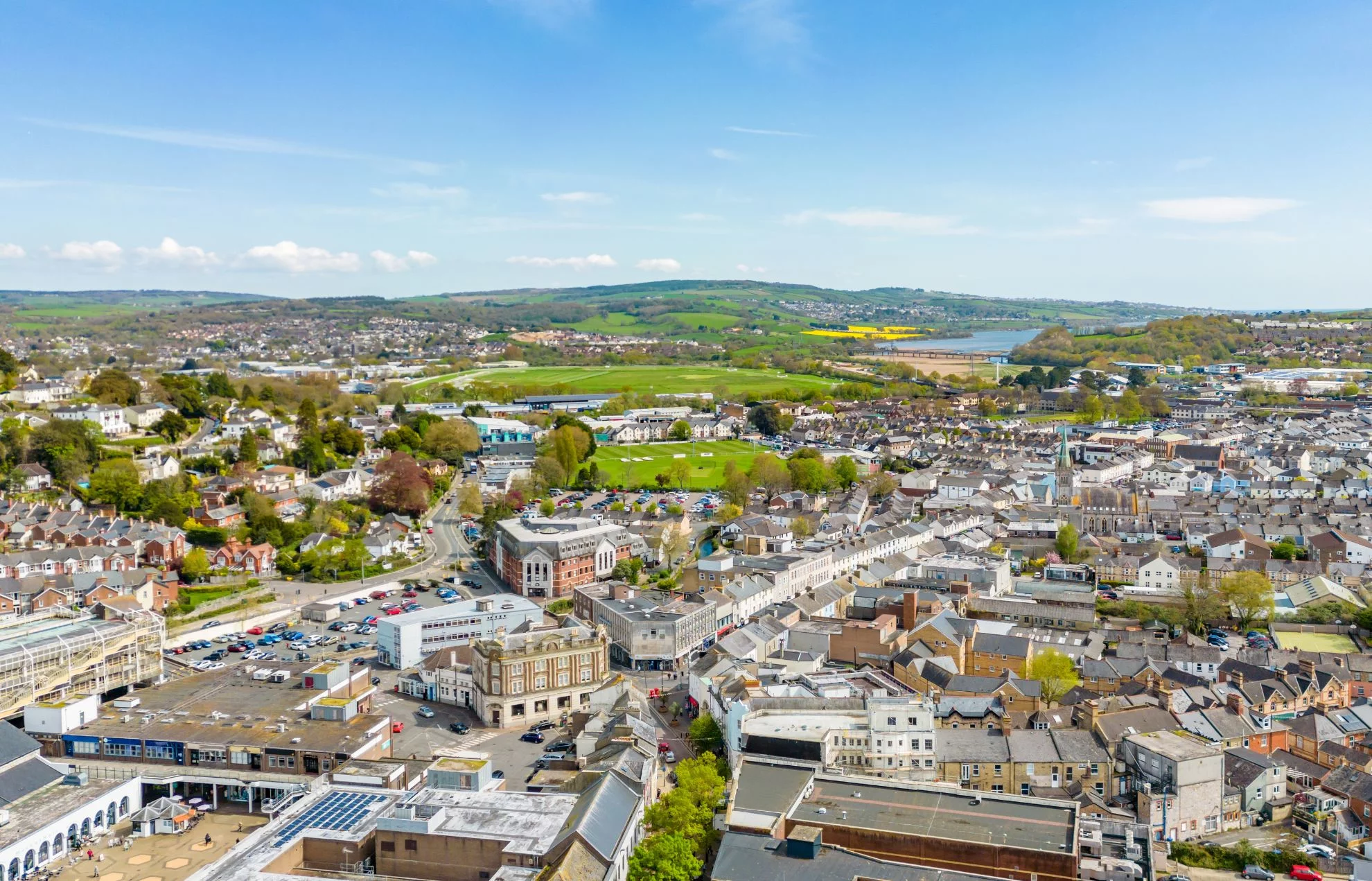 An aerial photograph taken from the perspective of a drone or helicopter of the town Newton Abbot in the South West of England.