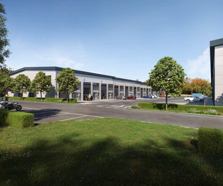 CGI representation of the entrance to West Park Business Park, where affordable industrial units are occupied, cars are parked, and lush green spaces adorn the surroundings.