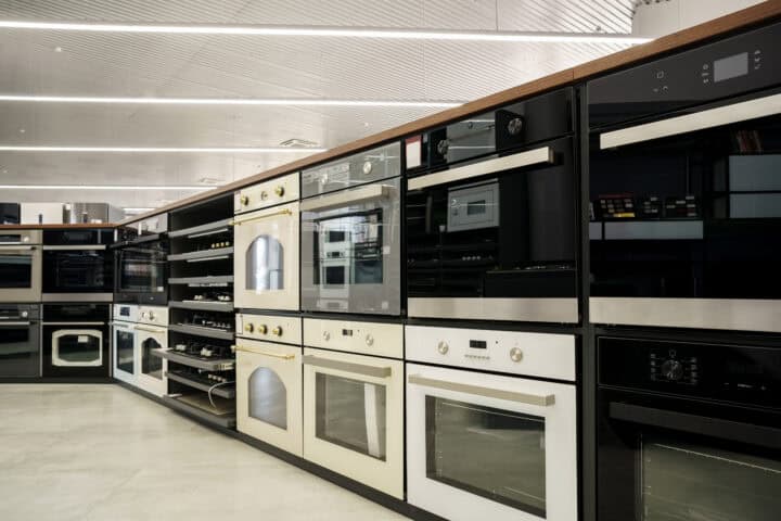 Commercial appliances lining a showroom, showcasing the available appliances.